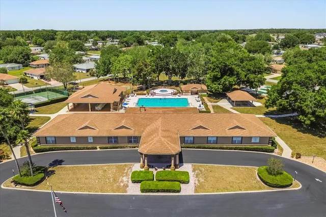 an aerial view of residential house with outdoor space and parking
