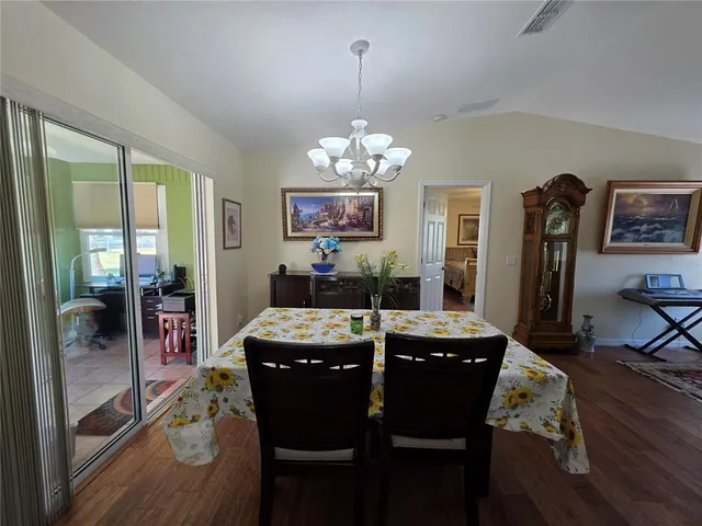 a kitchen with a sink stove top oven and cabinets