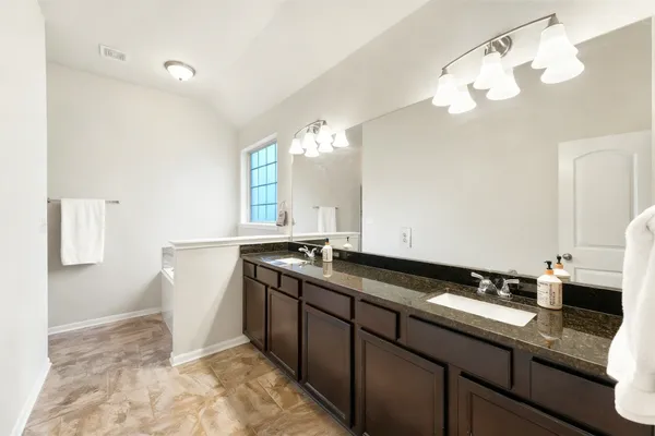 a kitchen with a sink and a stove