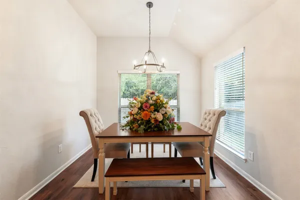 a dining room with furniture and window