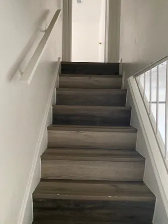 a bathroom with a sink a toilet and a shower