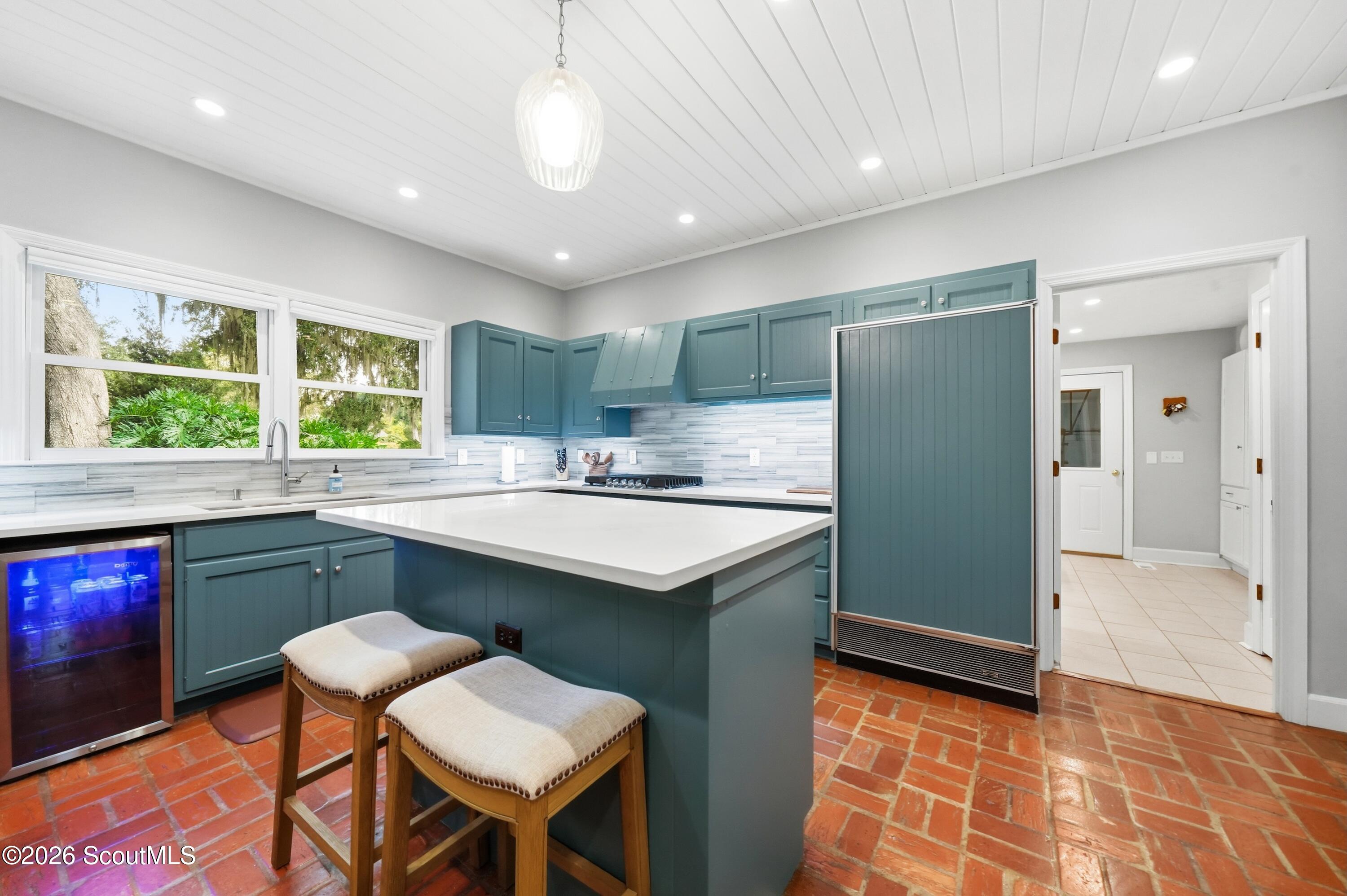 109 Tall Pine Road St. Simons Island, GA 31522 - Photo 14 of 50 The large kitchen features an island with a breakfast bar.