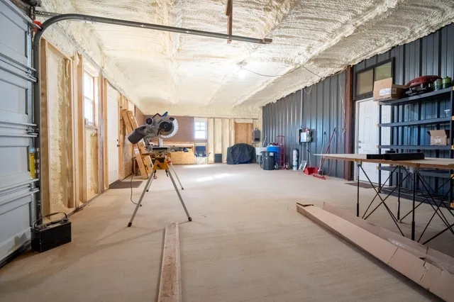 a view of a livingroom with furniture and a flat screen tv