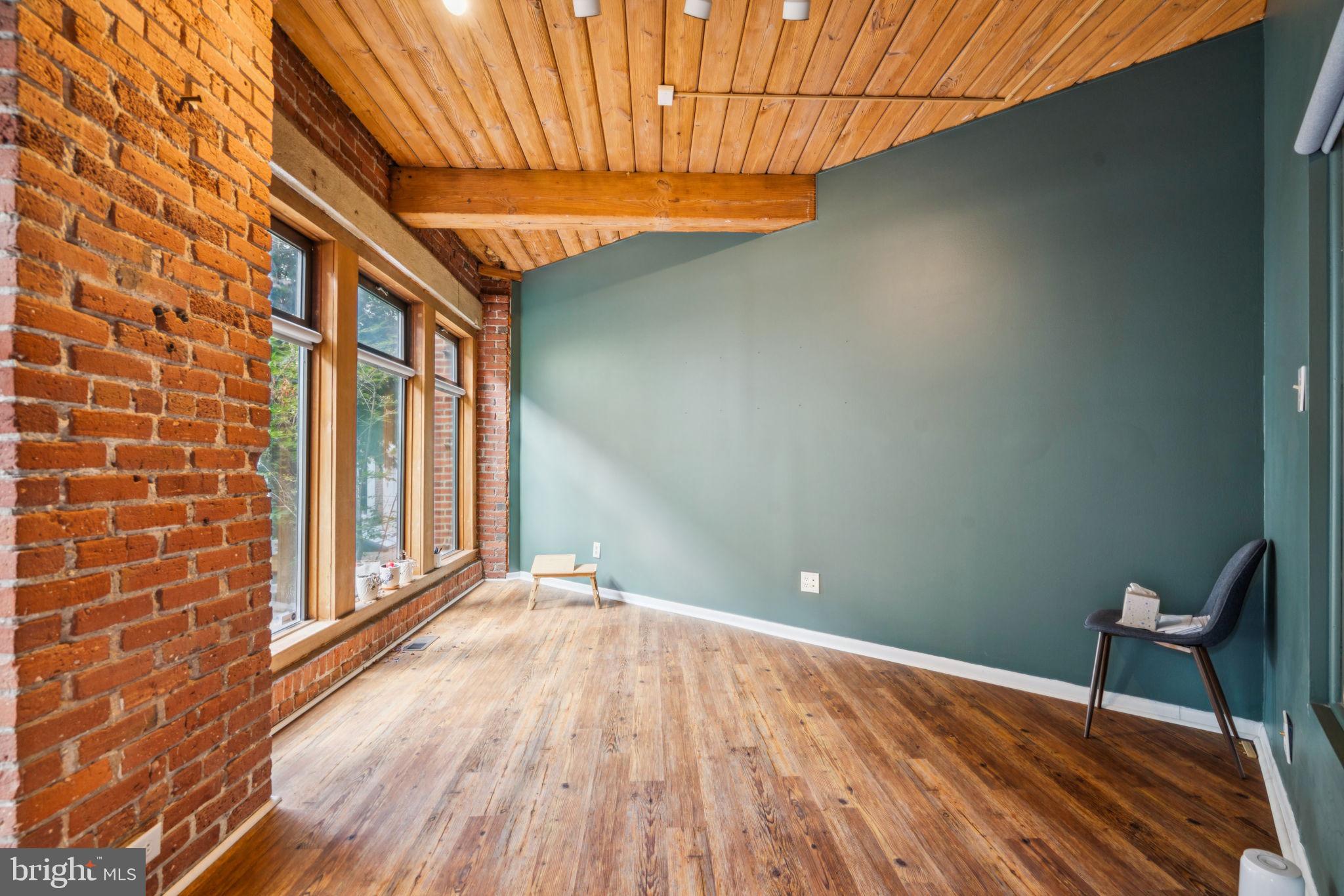 115 Cuthbert Street, Unit B Philadelphia, PA 19106 - Photo 24 of 30 a view of a room with wooden floor and chair