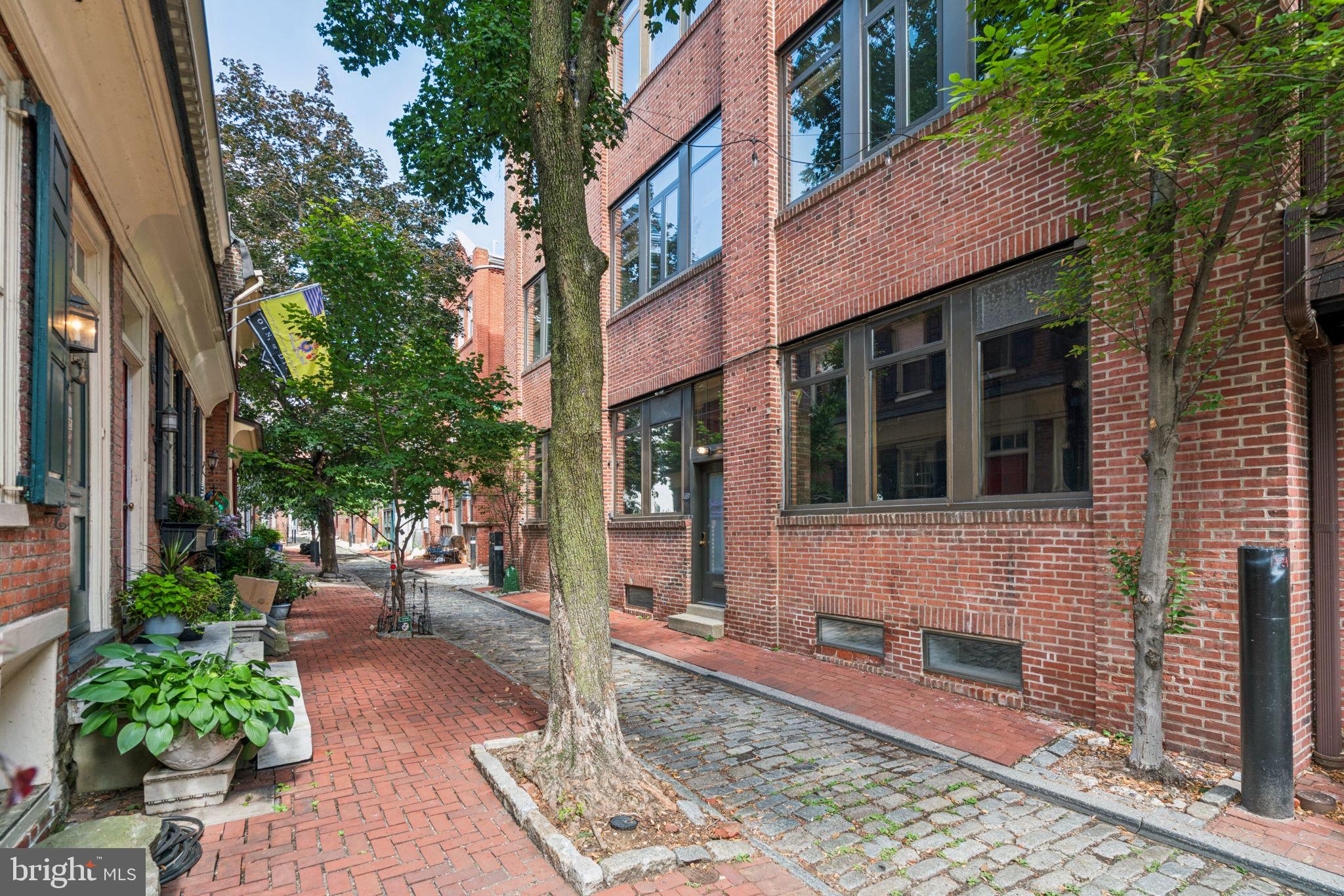 115 Cuthbert Street, Unit B Philadelphia, PA 19106 - Photo 28 of 30 a view of a brick building with many windows