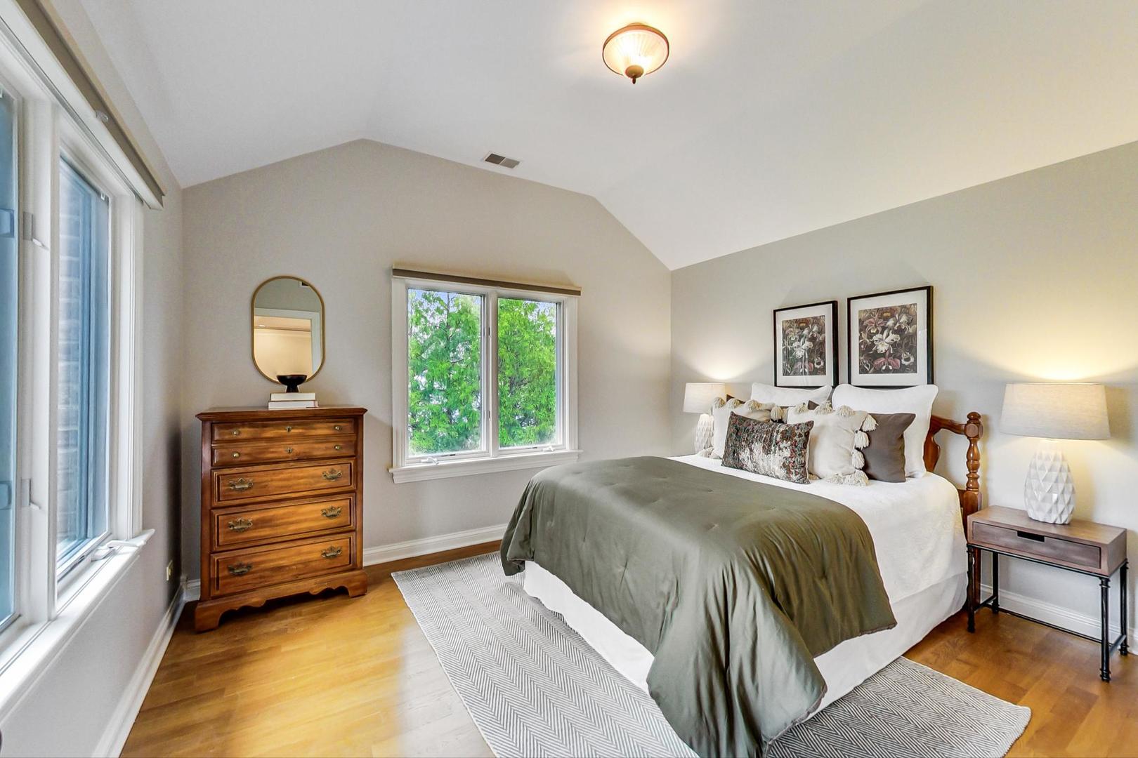 2027 Maple Avenue Northbrook, IL 60062 - Photo 14 of 27 a bedroom with a bed and a dresser