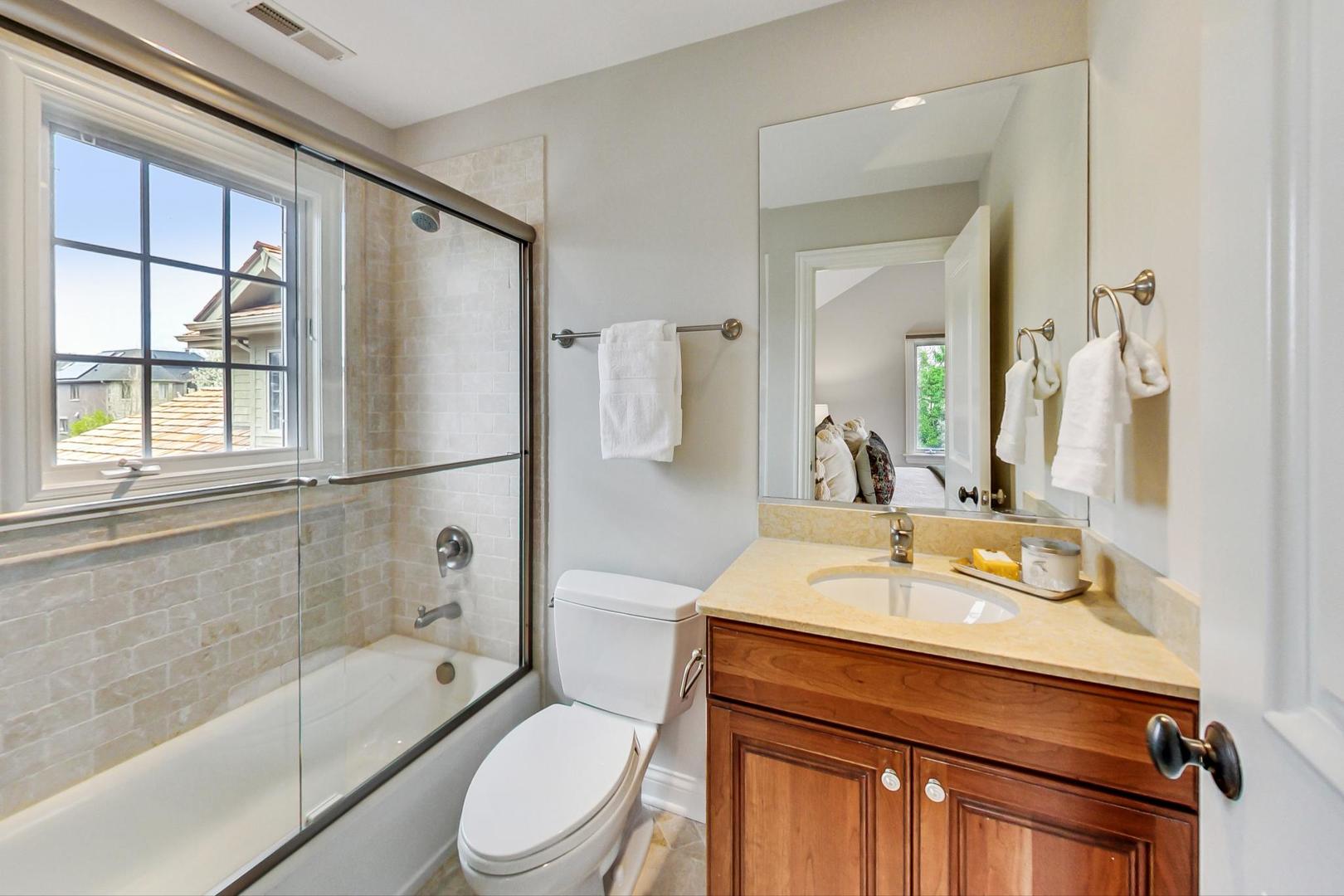 2027 Maple Avenue Northbrook, IL 60062 - Photo 15 of 27 a bathroom with a sink toilet and shower