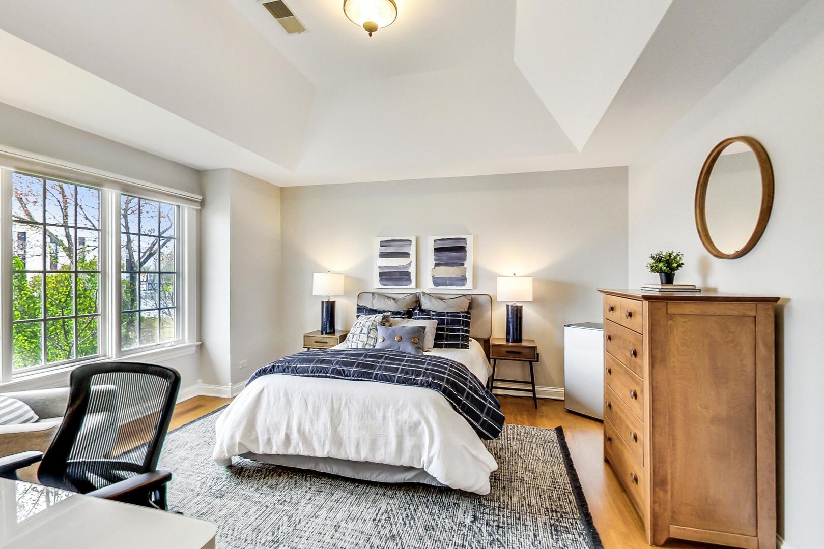 2027 Maple Avenue Northbrook, IL 60062 - Photo 16 of 27 a bedroom with furniture and a window