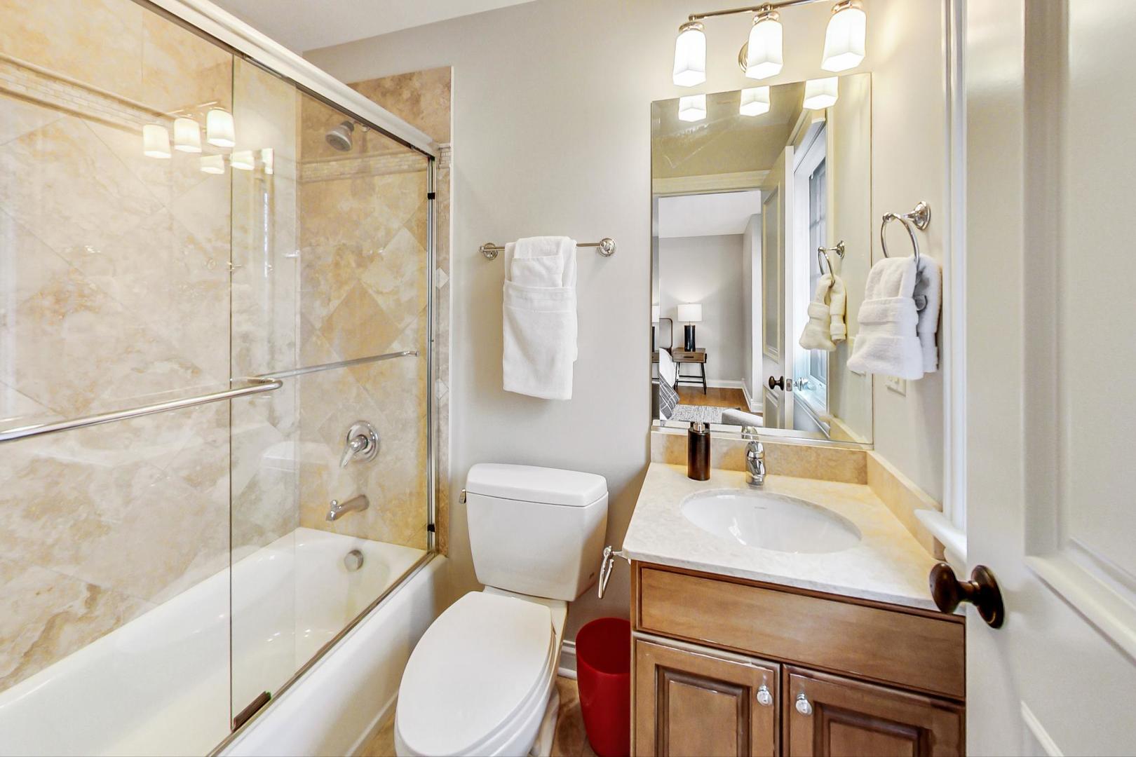 2027 Maple Avenue Northbrook, IL 60062 - Photo 17 of 27 a bathroom with a sink toilet and shower