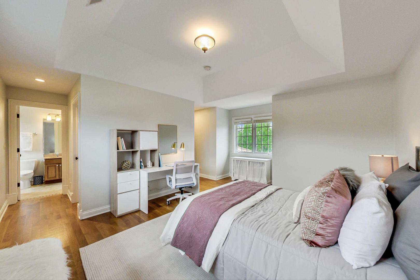 2027 Maple Avenue Northbrook, IL 60062 - Photo 18 of 27 a bedroom with a bed and a view of kitchen
