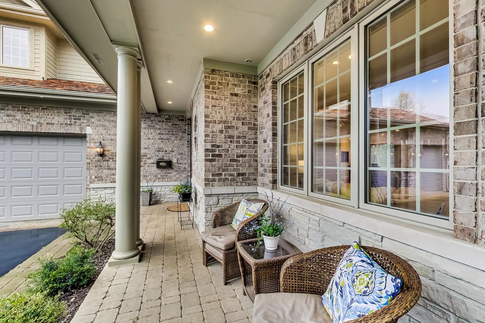 2027 Maple Avenue Northbrook, IL 60062 - Photo 2 of 27 a view of a patio with table and chairs and potted plants