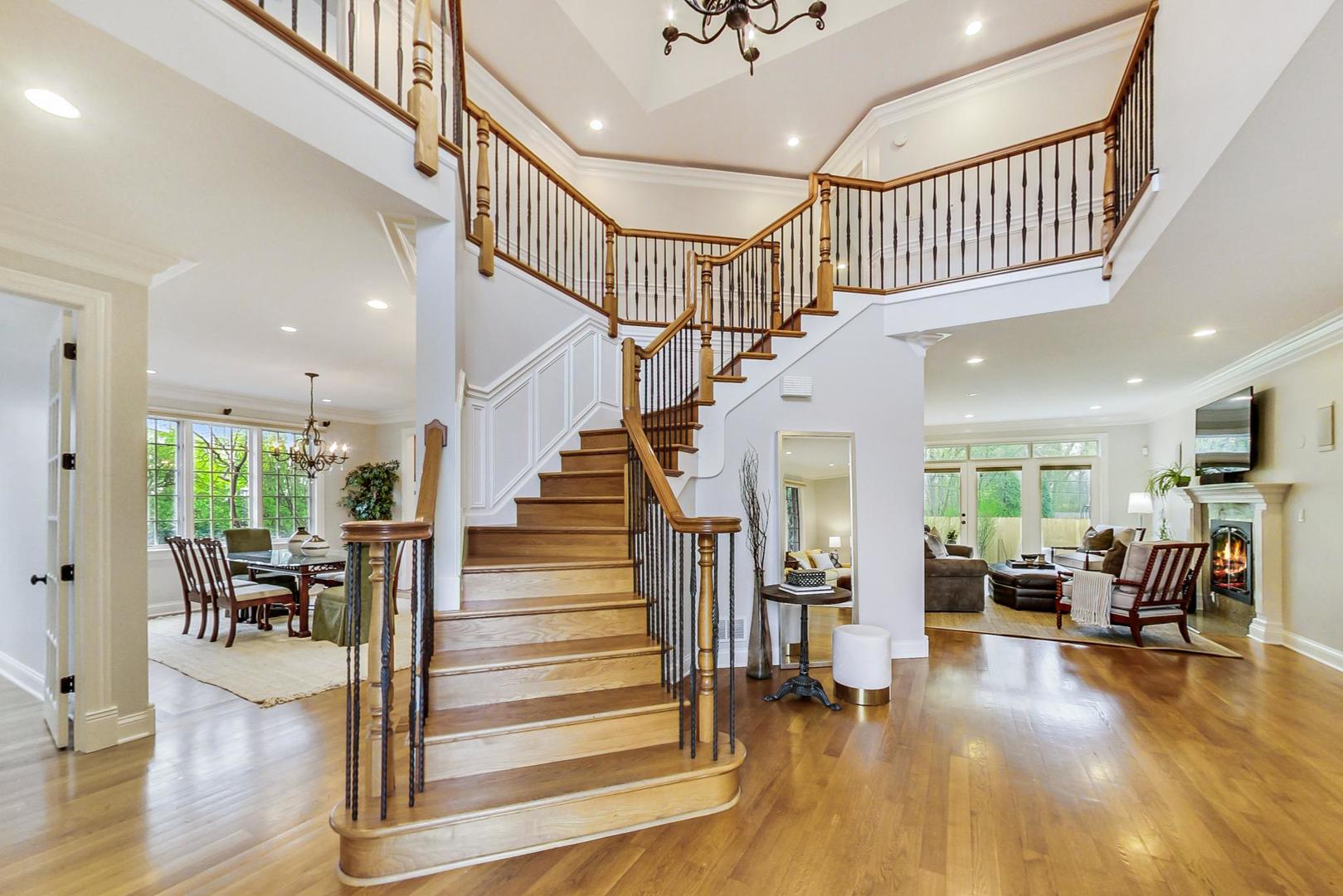 2027 Maple Avenue Northbrook, IL 60062 - Photo 3 of 27 a view of staircase and dining room with wooden floor