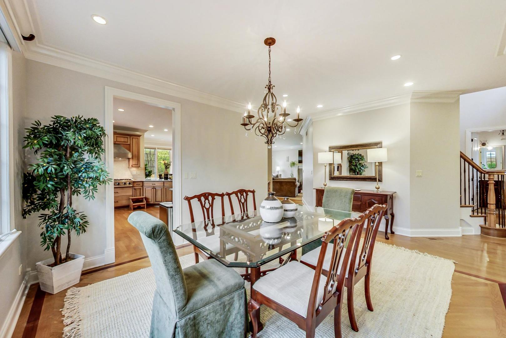 2027 Maple Avenue Northbrook, IL 60062 - Photo 5 of 27 a view of a dining room with furniture and chandelier