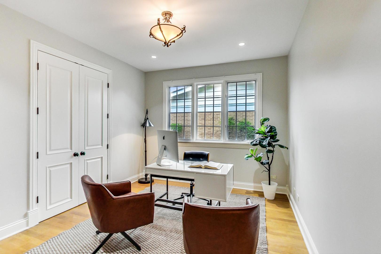 2027 Maple Avenue Northbrook, IL 60062 - Photo 9 of 27 a living room with furniture and a potted plant