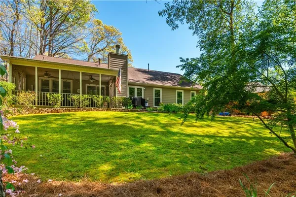 a front view of house with yard and green space