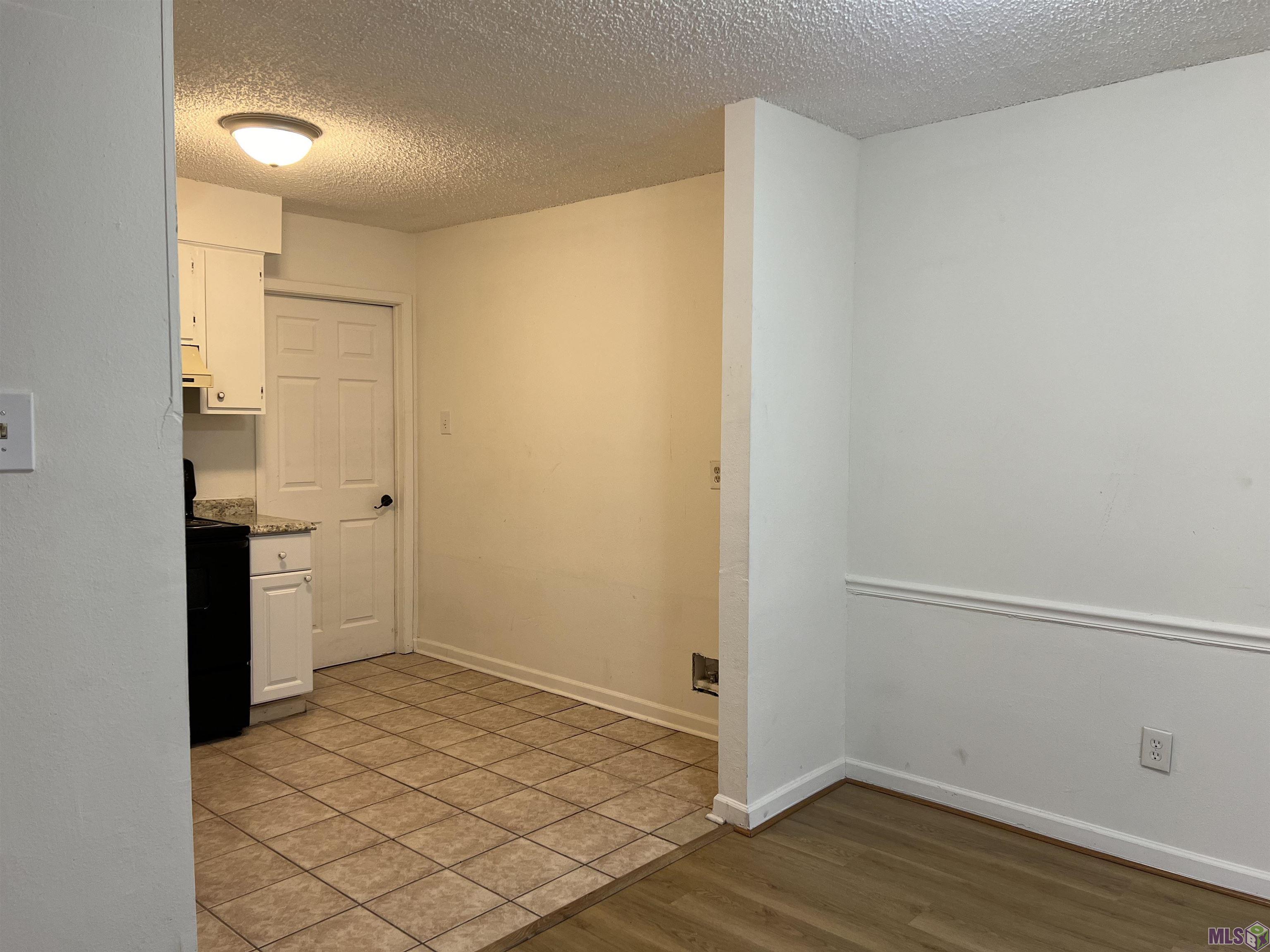 8739 Aubin Road Denham Springs, LA 70726 - Photo 5 of 9 Dining to kitchen