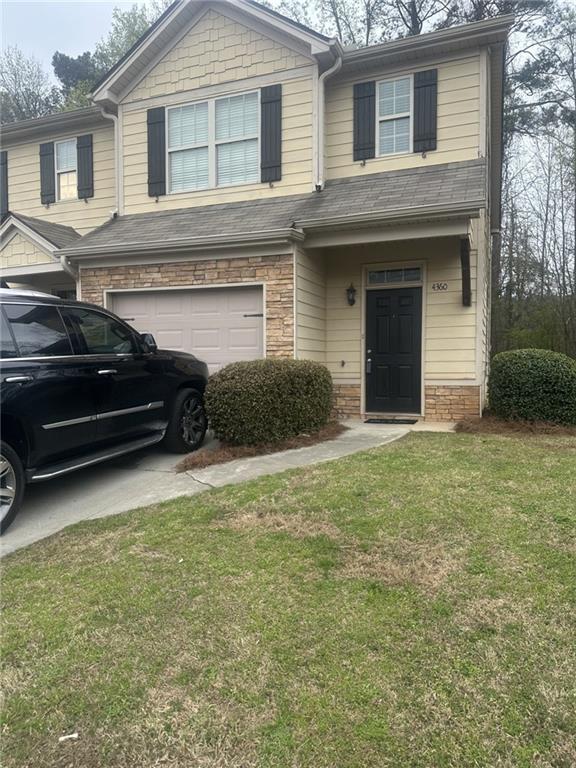 4360 Stone Gate Way, Unit 92 Atlanta, GA 30344 - Photo 11 of 18 a view of a house with a garden