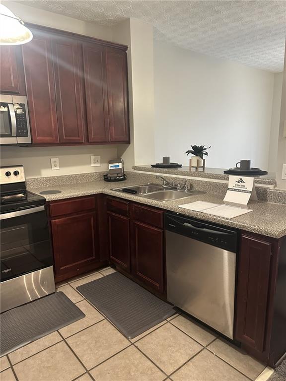4360 Stone Gate Way, Unit 92 Atlanta, GA 30344 - Photo 12 of 18 a kitchen with stainless steel appliances granite countertop a sink stove and cabinets