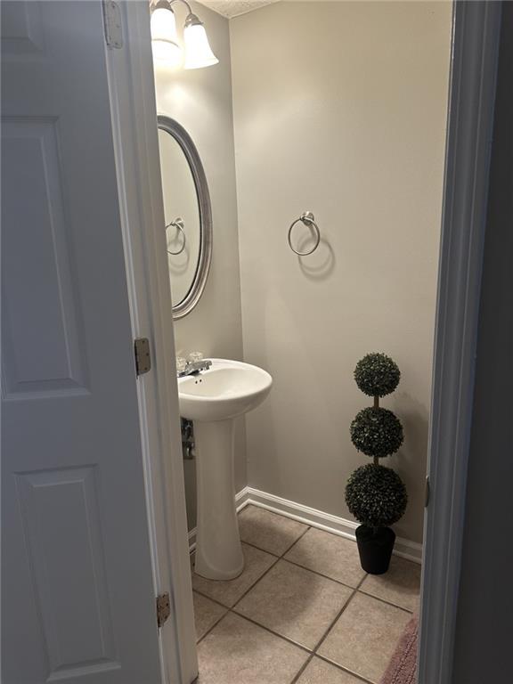 4360 Stone Gate Way, Unit 92 Atlanta, GA 30344 - Photo 13 of 18 a bathroom with a toilet and a sink