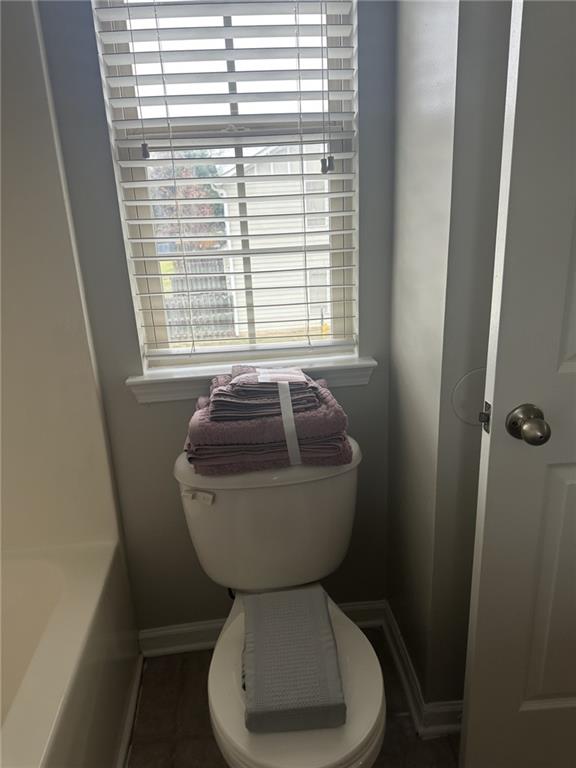 4360 Stone Gate Way, Unit 92 Atlanta, GA 30344 - Photo 16 of 18 a bathroom with a toilet and a window