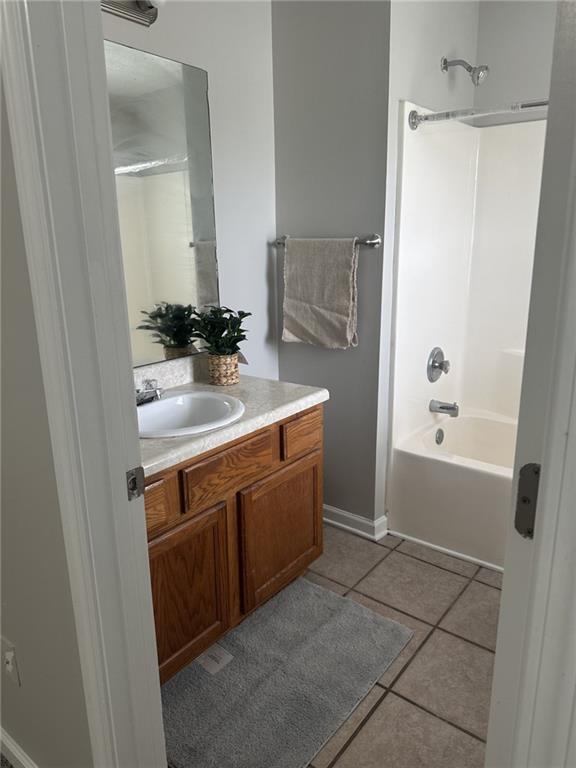 4360 Stone Gate Way, Unit 92 Atlanta, GA 30344 - Photo 18 of 18 a bathroom with a sink and a mirror