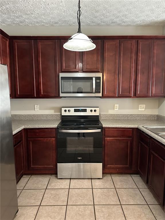 4360 Stone Gate Way, Unit 92 Atlanta, GA 30344 - Photo 2 of 18 a kitchen with granite countertop a stove and a cabinets