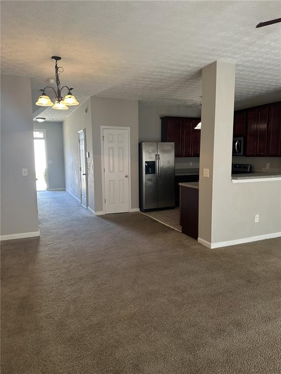 4360 Stone Gate Way, Unit 92 Atlanta, GA 30344 - Photo 5 of 18 a view of a kitchen with a sink and a refrigerator