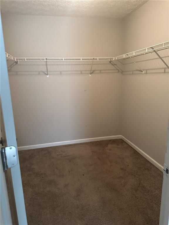 4360 Stone Gate Way, Unit 92 Atlanta, GA 30344 - Photo 6 of 18 a view of a room with racks on the wall