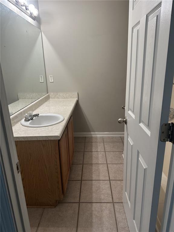 4360 Stone Gate Way, Unit 92 Atlanta, GA 30344 - Photo 7 of 18 a bathroom with a sink a vanity and a mirror