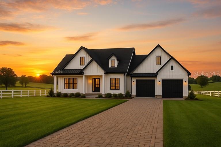 a front view of house with yard and green space