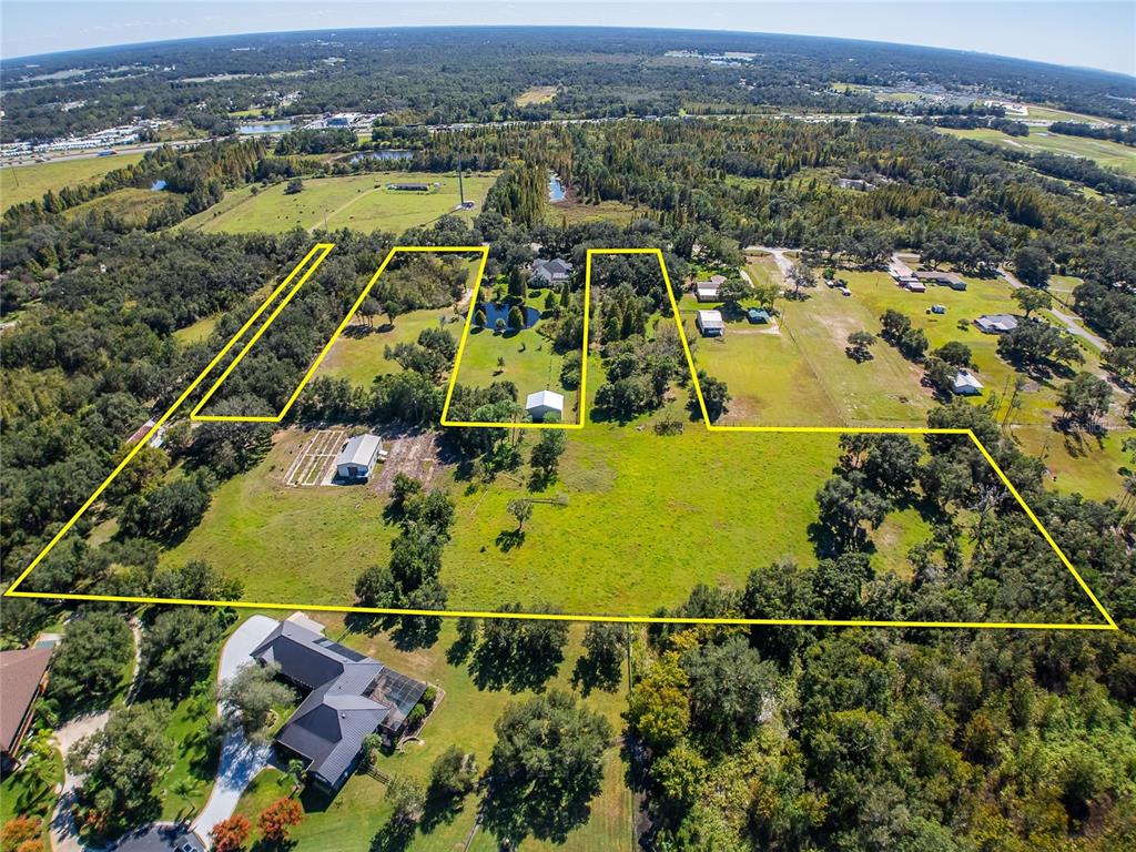 6930 Muck Pond Road Seffner, FL 33584 - Photo 11 of 23 an aerial view of residential houses with outdoor space