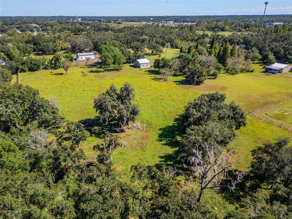 6930 Muck Pond Road Seffner, FL 33584 - Photo 9 of 23 a view of an ocean with boats and trees all around