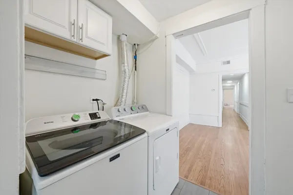 a utility room with washer and dryer