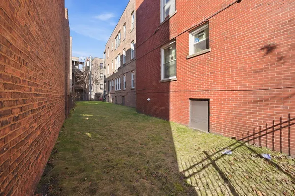 a brick building with a yard