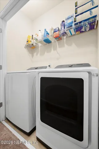 a utility room with dryer and washer