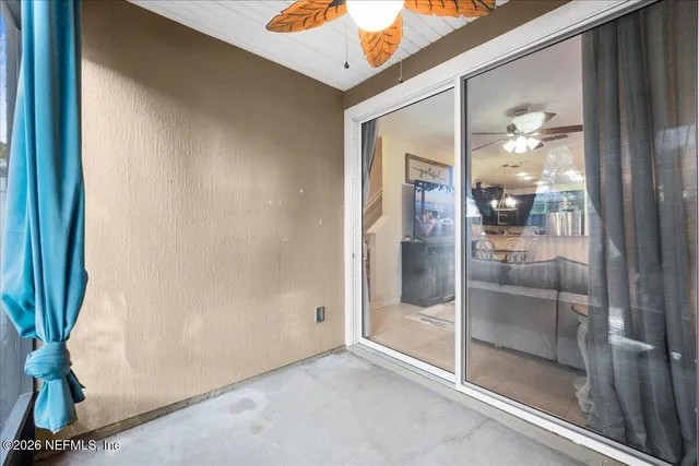 a view of a bathroom with a glass door