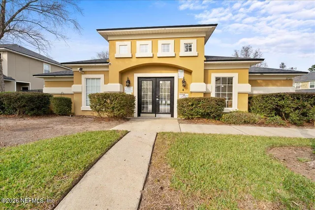 a front view of a house with garden