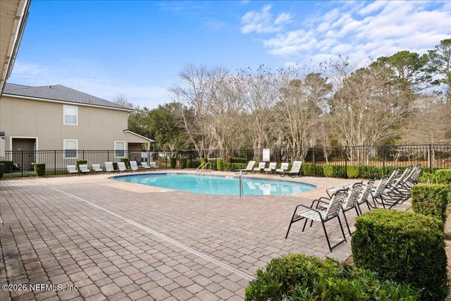 a view of a swimming pool with a patio