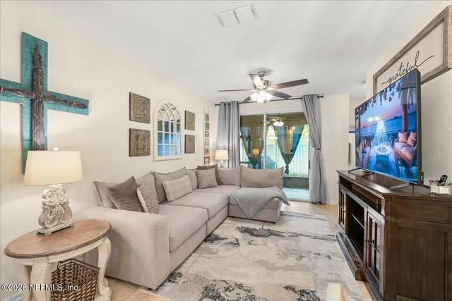 a living room with furniture and a large window