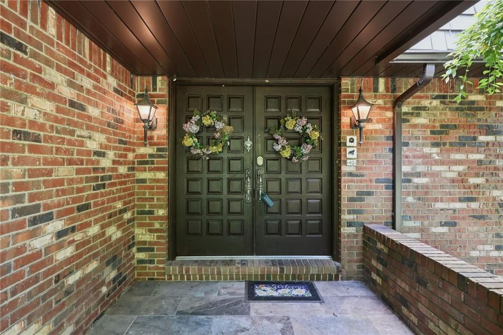 21 West Hillcrest Road Eighty Four, PA 15330 - Photo 5 of 40 A beautiful covered front porch is perfect for greeting guests. The front porch features stone tile flooring and a double door front entrance.