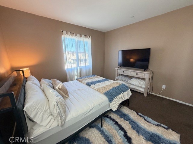 29451 Beeler Road Winchester, CA 92596 - Photo 15 of 19 a bedroom with a bed and a flat screen tv