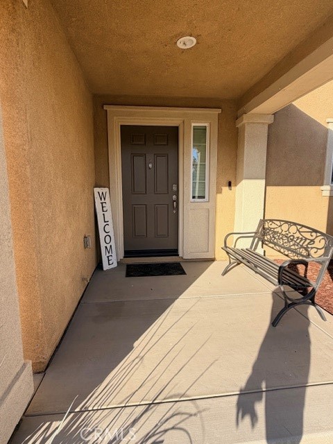 29451 Beeler Road Winchester, CA 92596 - Photo 2 of 19 a bedroom with a bed and large windows