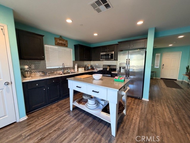 29451 Beeler Road Winchester, CA 92596 - Photo 4 of 19 a kitchen with a sink appliances and cabinets