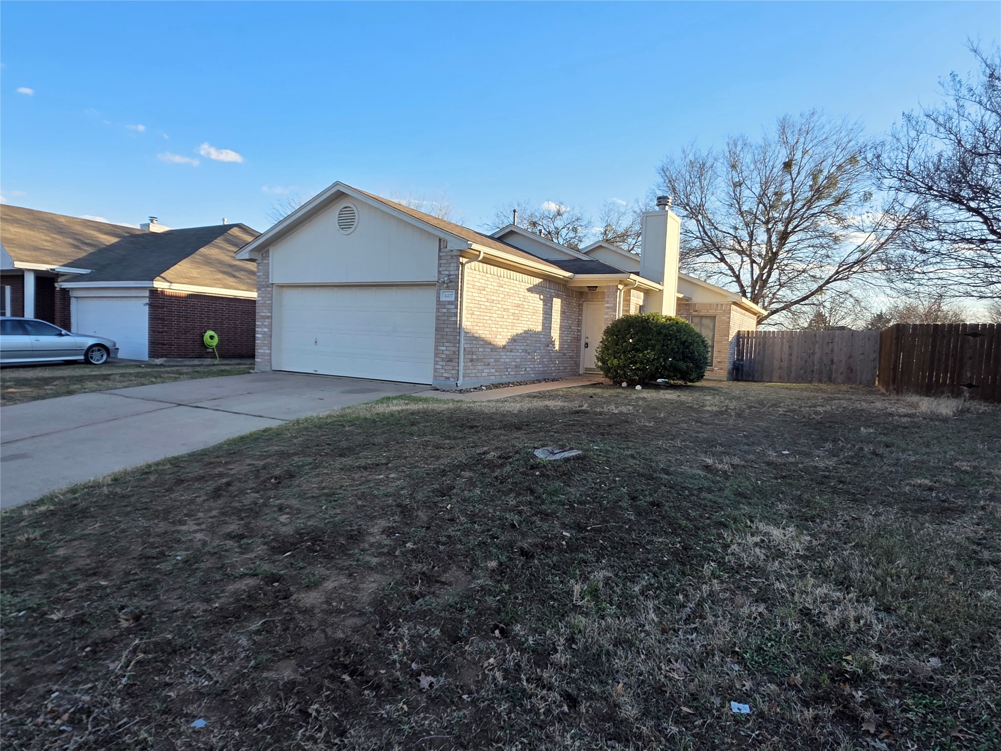 4417 Lendall Lane Austin, TX 78744 - Photo 1 of 23 a view of a house with a yard and garage