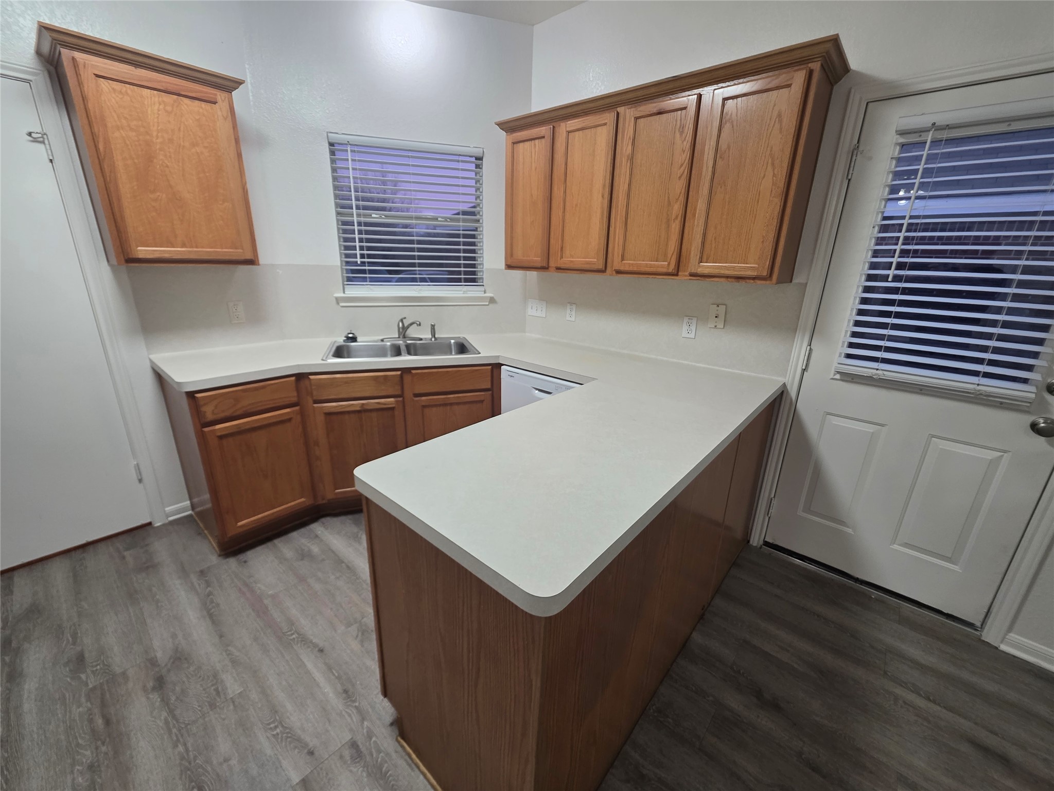 4417 Lendall Lane Austin, TX 78744 - Photo 20 of 23 a kitchen with stainless steel appliances granite countertop a sink stove and wooden floor