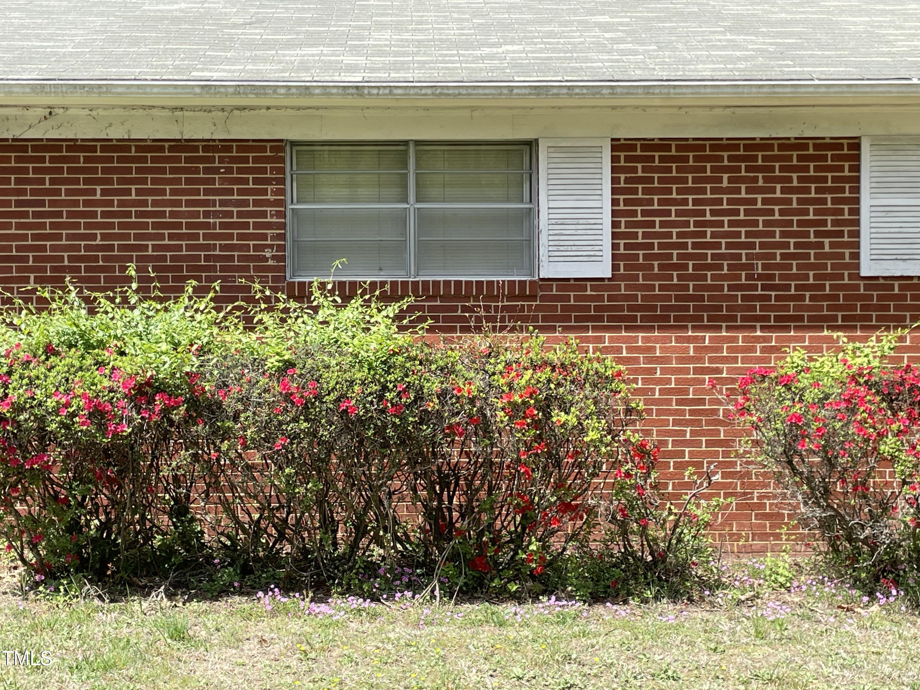 3311 Redwood Road Durham, NC 27704 - Photo 12 of 32 a view of a house with a flower garden