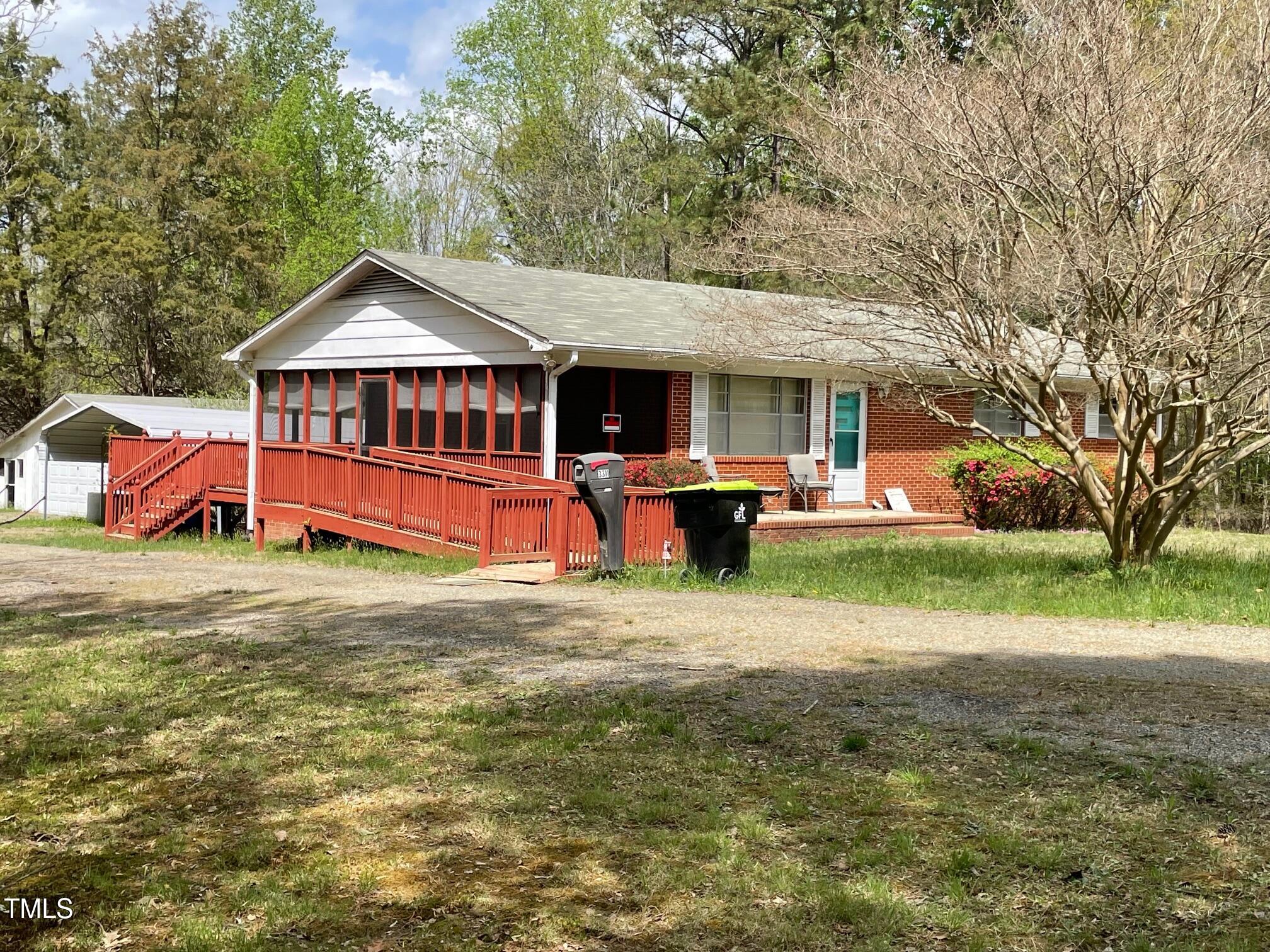 3311 Redwood Road Durham, NC 27704 - Photo 3 of 32 a view of a house with a yard