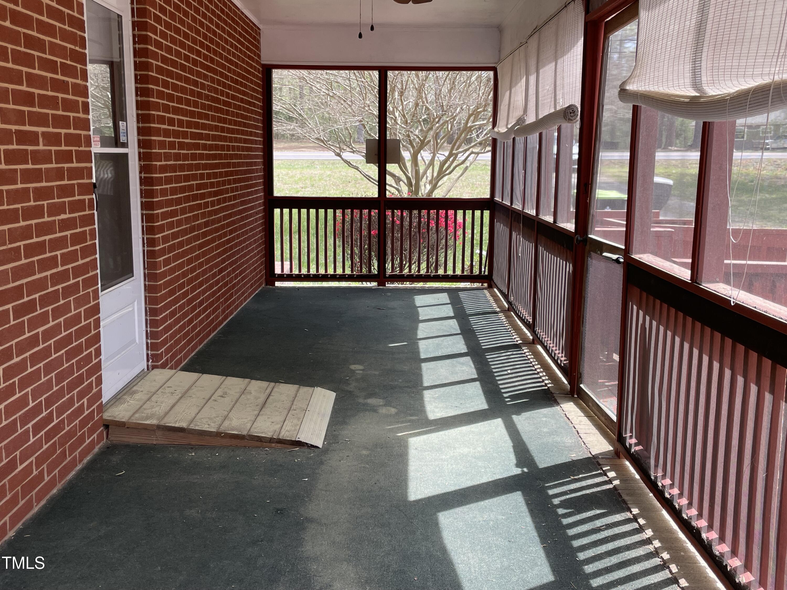 3311 Redwood Road Durham, NC 27704 - Photo 5 of 32 a view of a balcony with wooden floor