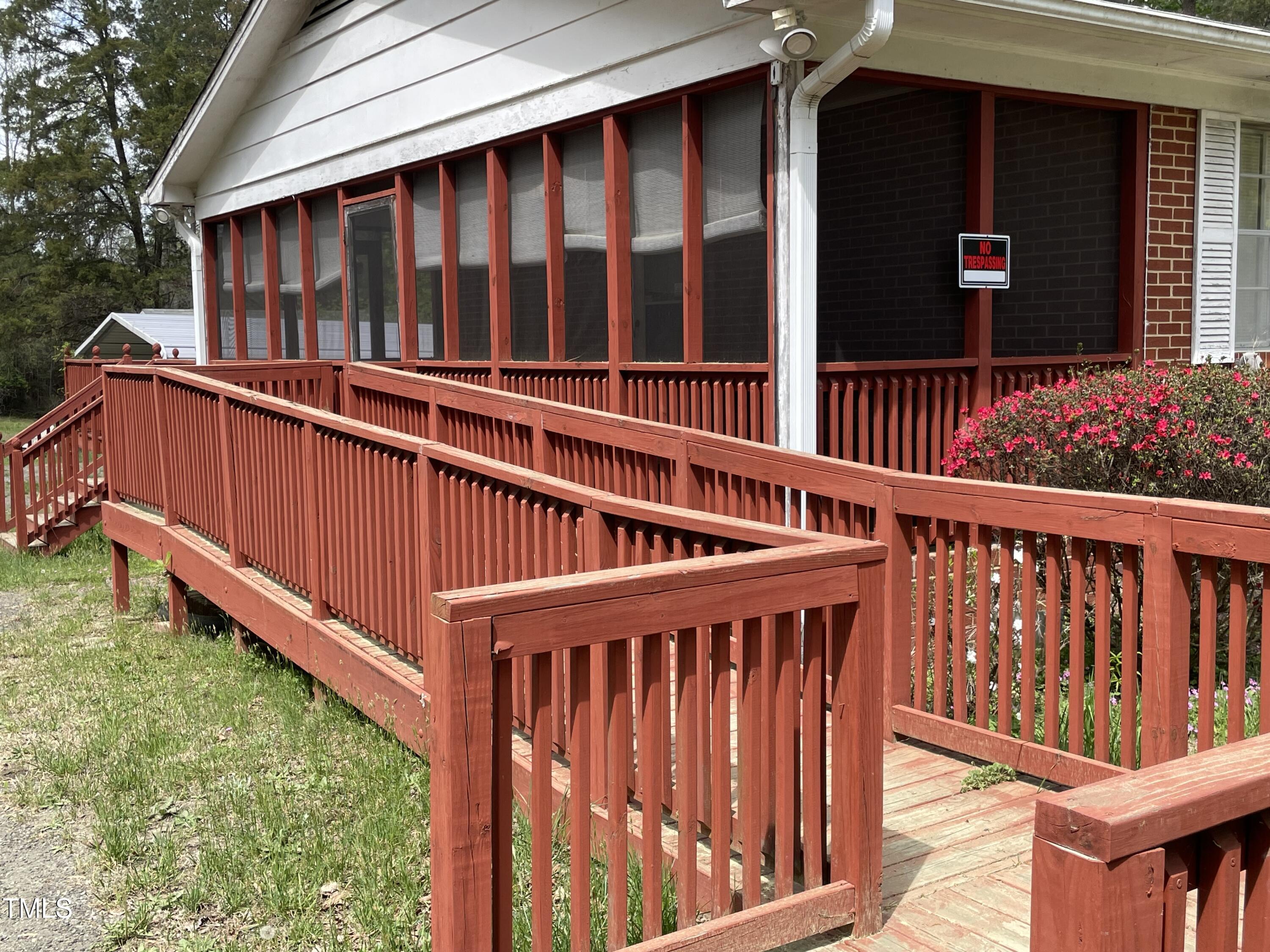 3311 Redwood Road Durham, NC 27704 - Photo 6 of 32 a view of a wooden house with a wooden deck