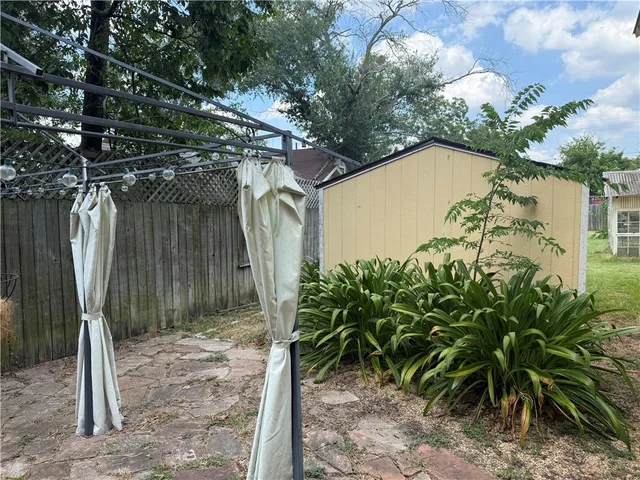 a backyard of a house with lots of green space